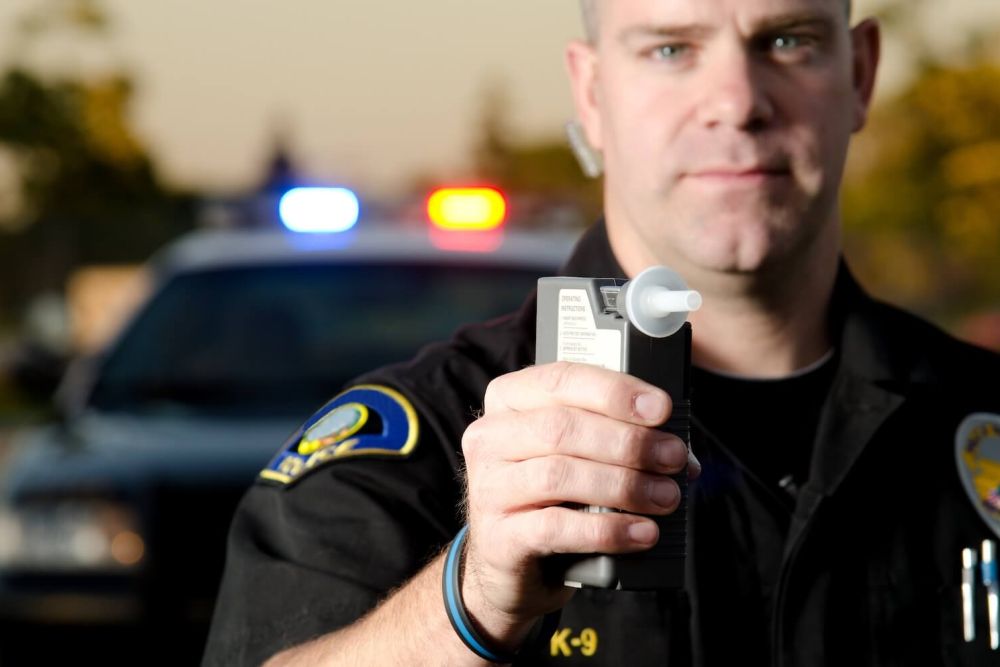 police office with DUI Breathalyzer